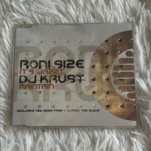 Vintage CD with Silver and Brown Design